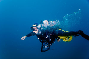 Diver using scooter.